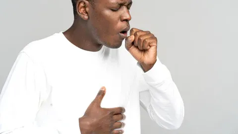 A_man_covering_a_productive_cough_with_his_hand_480x480.webp