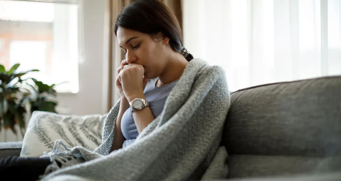 A Women suffering from fever and cough