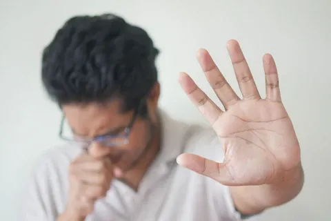 Man-trying-to-stop-coughing_480x480.webp