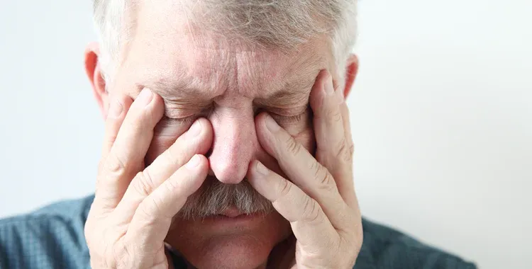 A old man with Sinus Pressure